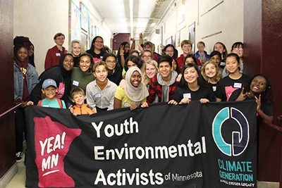 Jordan akers and Meera dear with group from the Youth Climate kickoff